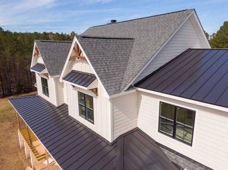 Homeowner observing a residential roof while checking gutters and roof edges after seasonal weather.